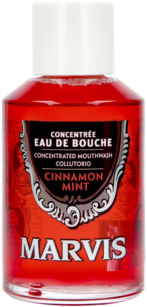 Red mouthwash bottle with a white cap, labeled cinnamon mint flavor, from Marvis brand.