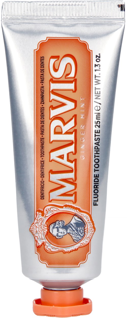 A white tube of Marvis toothpaste with orange accents and a logo of a woman in a circle on the front.