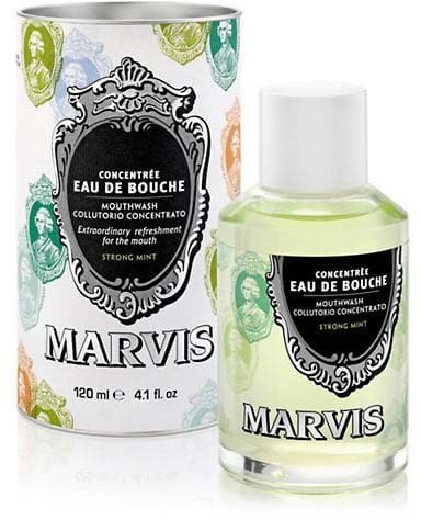 A mouthwash bottle and box with black, white, and colorful design, labeled Marvis, strong mint flavor.