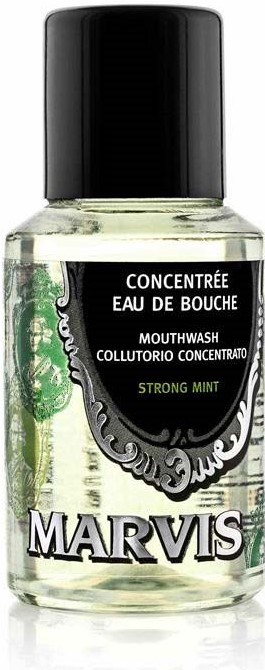 Small bottle of Marvis mouthwash with green mint flavor label and black cap.