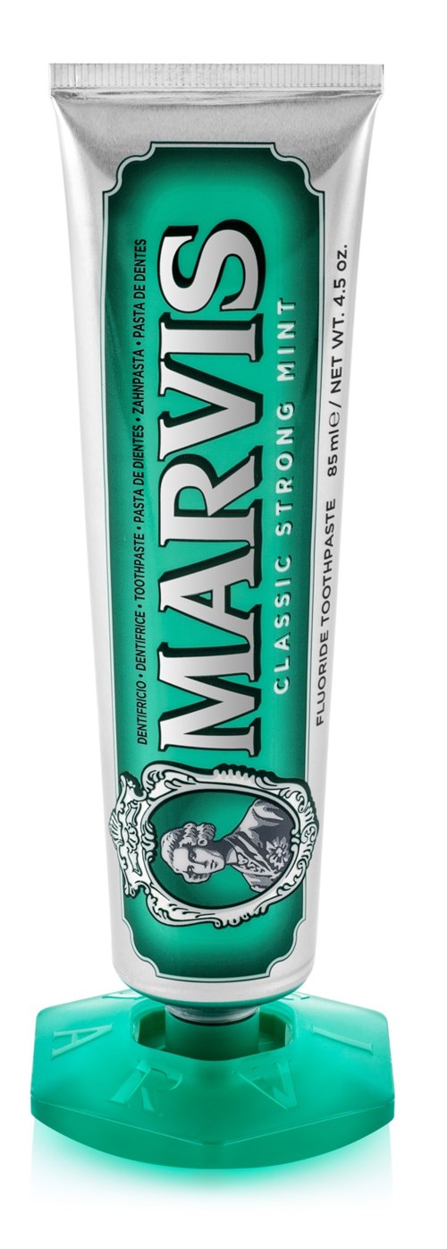 A tube of Marvis Classic Strong Mint toothpaste with green and white packaging and a matching cap.