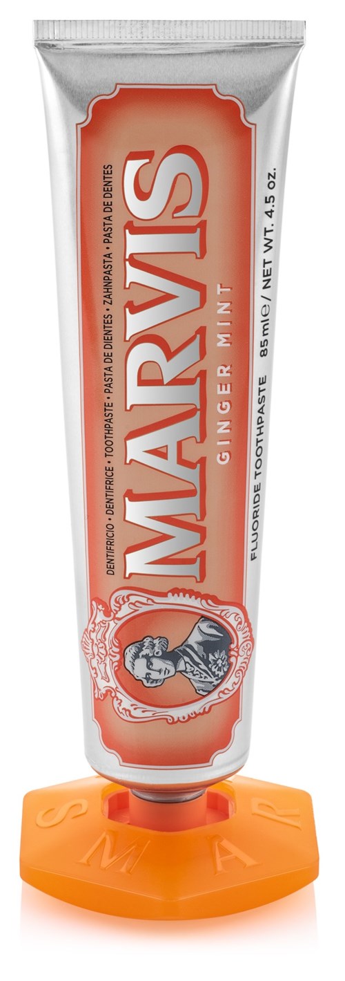 A tube of Marvis ginger mint toothpaste with orange cap and label. It stands upright and shows the brand name clearly.