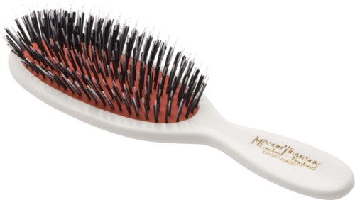 A hairbrush with black and red bristles, white handle, and gold text on the handle.