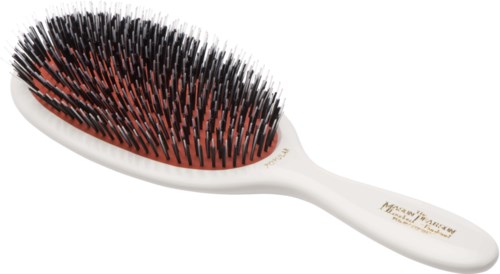 A hairbrush with black and red bristles and a white handle, designed to detangle and style hair.