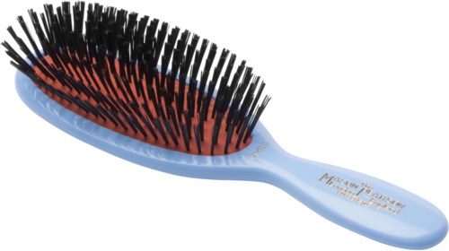 A light blue hairbrush with black bristles and a cushioned base.
