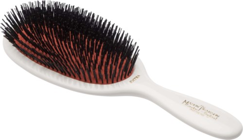 A hairbrush with black and red bristles and a white handle, designed for detangling hair.