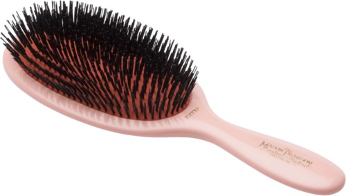 A pink hairbrush with black bristles, used for brushing hair.