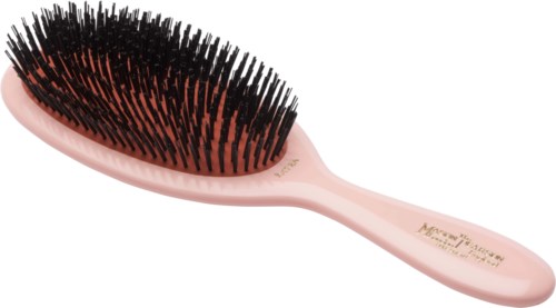 A pink hairbrush with black bristles, designed for detangling hair.