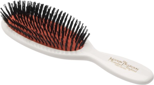 A hairbrush with black and red bristles and a white handle, labeled "Mississippi".