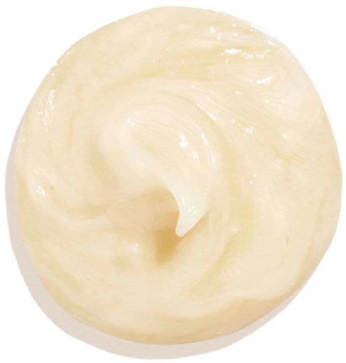 Eine cremefarbene, gewellte Substanz mit glatter, glänzender Oberfläche, ähnlich einem Milchprodukt oder Zuckerguss.
