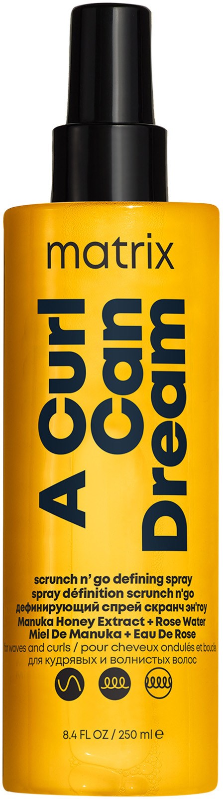 Gelbe Flasche mit schwarzem Sprühverschluss, beschriftet 'A Curl Can Dream' von Matrix, beschreibt ein definierendes Spray für Locken.