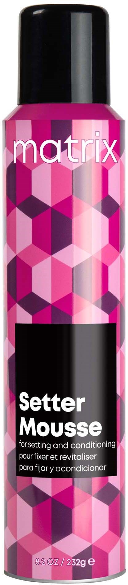 Eine rosa und lila gemusterte Spraydose mit der Aufschrift 'Matrix Setter Mousse' für Haarstyling.