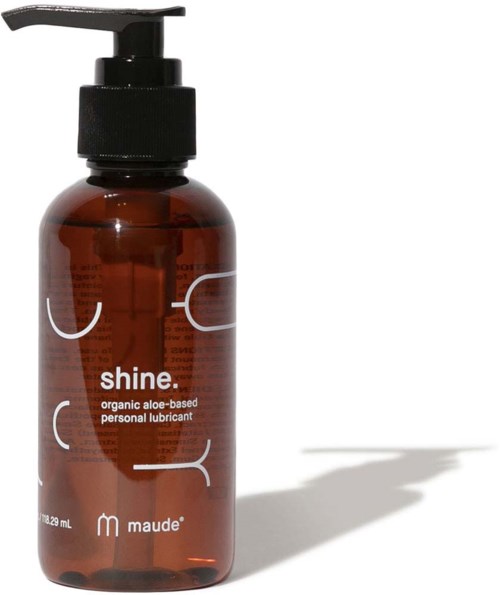 Eine braune Flasche mit schwarzem Pumpspender und der Bezeichnung "shine" und 