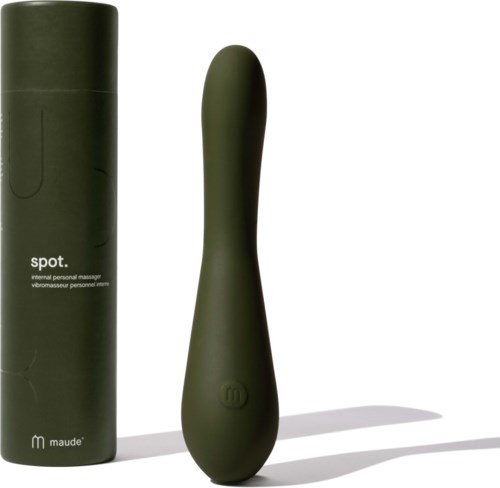 Ein grünes persönliches Massagegerät mit passender zylindrischer Aufbewahrungsbox. Das Gerät hat eine runde, ergonomische Form.