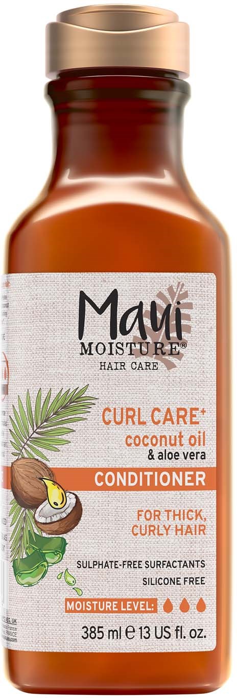 Een fles Maui Moisture Curl Care kokosolie en aloë vera conditioner voor dik, krullend haar.