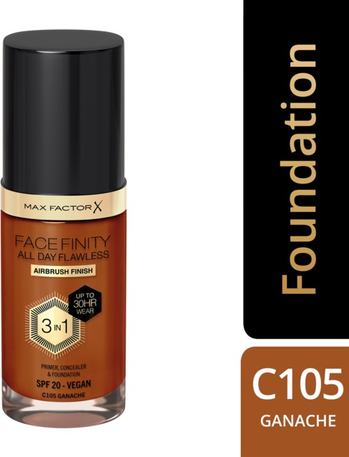En foundationflaska med svart lock, beige och brunt etikett, och text som indikerar att den är för ansiktsmakeup.
