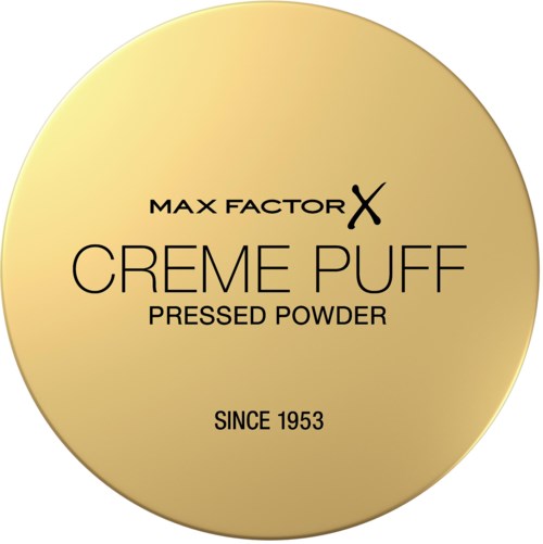 Een ronde, goudkleurige container met tekst die Max Factor Creme Puff pressed powder sinds 1953 adverteert.