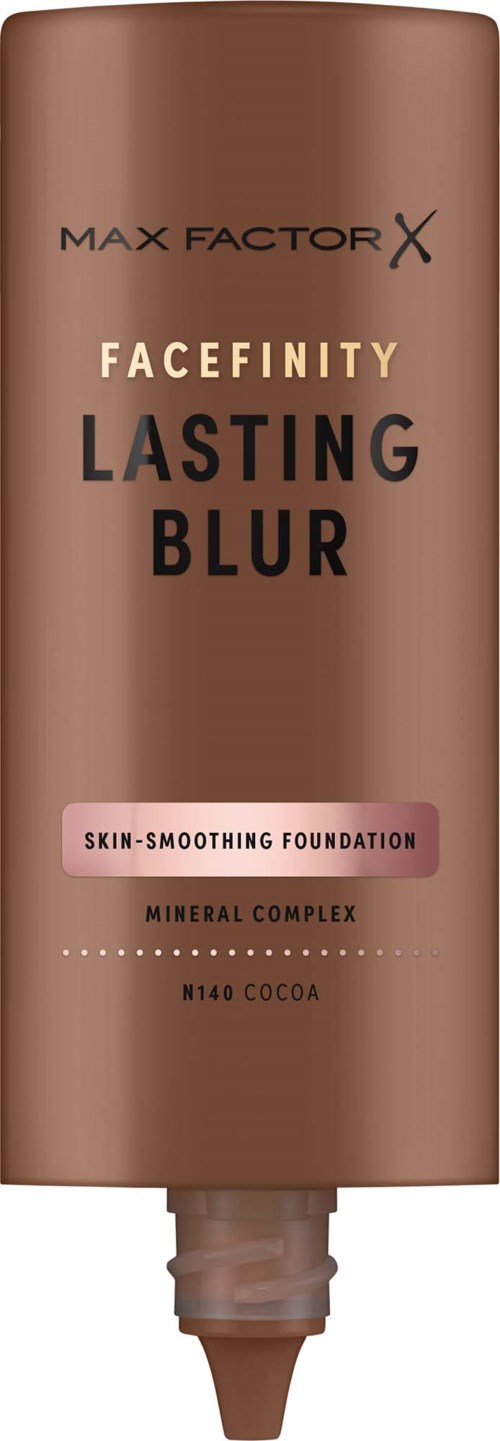 En brun tube fra Max Factor Facefinity Lasting Blur foundation med en rosa etikett som indikerer hudjevnende egenskaper.