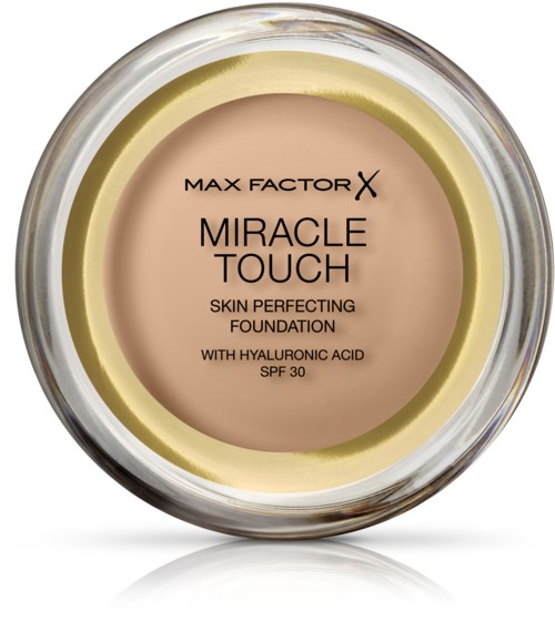 En burk med foundation märkt 'Max Factor X Miracle Touch' med påståenden om hudförbättring och SPF 30.
