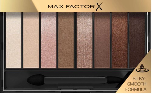 Een make-up palette met zes verschillende oogschaduwkleuren, van licht naar donker, in een zwarte doos met spiegel.