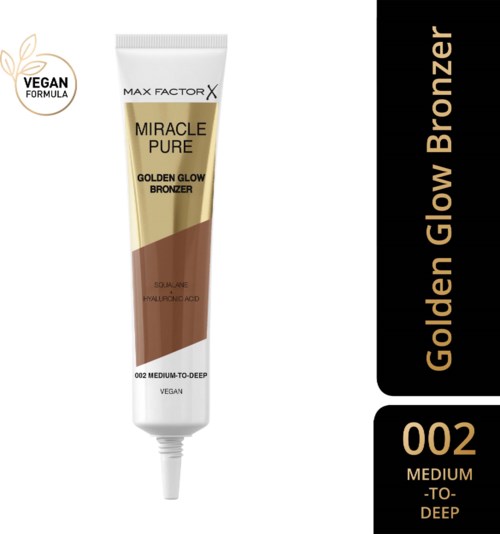 A tube of Max Factor Miracle Pure Golden Glow Bronzer for medium to deep skin tones, vegan formula, and includes nourishing acid.