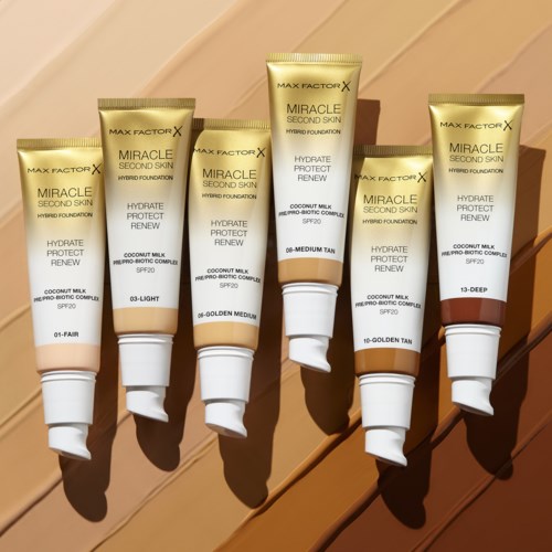 Sex tuber av Max Factor Miracle Second Skin-foundation i olika nyanser visas, med solljus som lyser på dem.