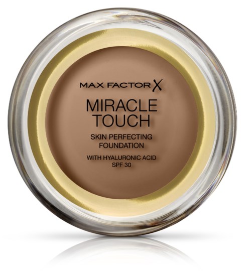 En rund burk med Max Factor Miracle Touch foundation i beige färg, märkning anger att den innehåller hyaluronsyra och SPF 30.
