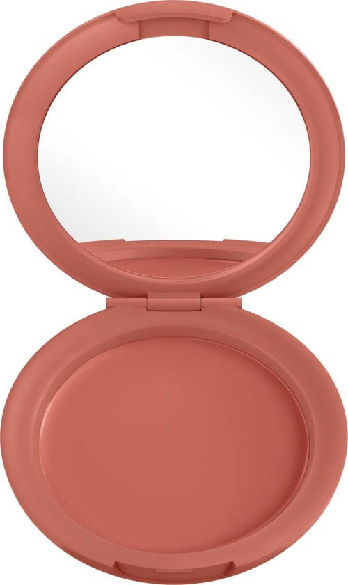 A round, pink makeup compact with a mirror inside, open showing the empty space for product.