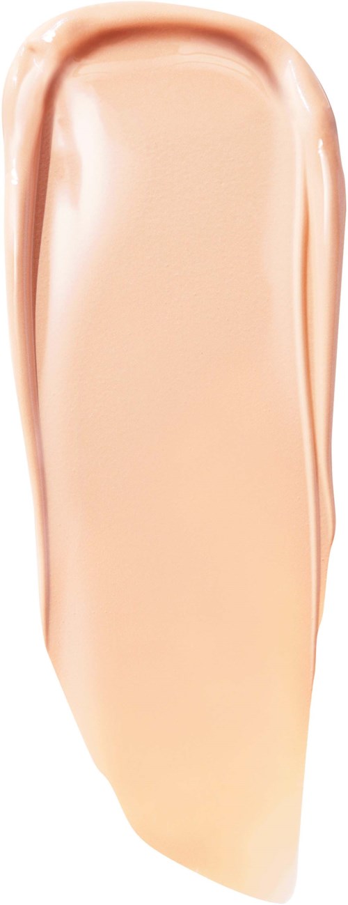 En beige eller ljusrosa flytande makeup-prov med slät, krämig textur på vit bakgrund.