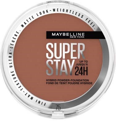 En Maybelline-foundationskräm i en rund behållare med brunt puder, svart och vit etikett och genomskinligt lock.