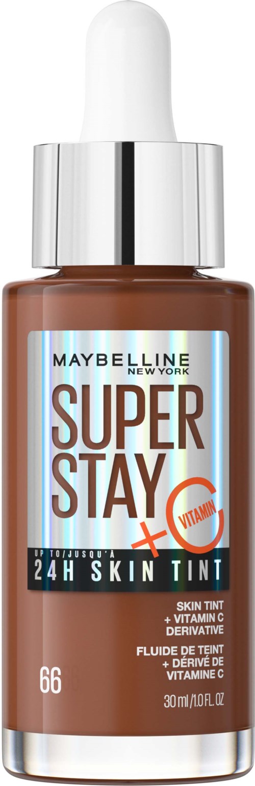 En liten brun glasflaska med vit pipettkork, märkt 'Maybelline Super Stay 24H Skin Tint' med vitamin C.
