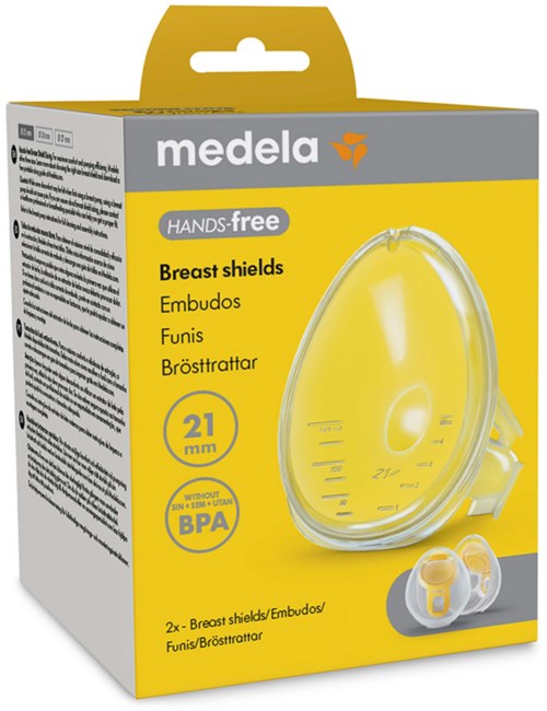Gelbes Paket mit klarem Brustschutz und zwei Silikonanschlüssen, mit Medela gekennzeichnet, für das Stillen.