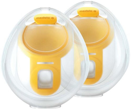 Two yellow Medela breast shields in clear plastic cases for breastfeeding. It is a medical device for milk collection.