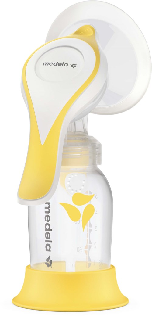 A yellow and white breast pump with attached milk bottle on a yellow stand.