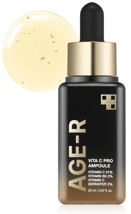 Een zwarte druppelfles met gouden dop, gemerkt AGER. Het bevat vitamine C, B5 en andere skincare ingrediënten.