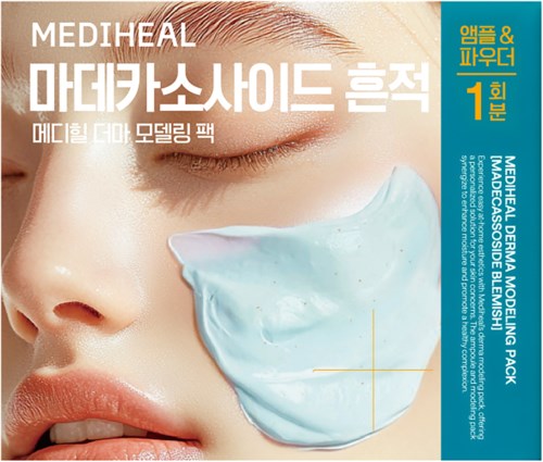A woman with closed eyes applies a light blue facial mask on her cheek.