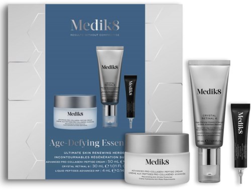 Medik8 skincare set including creams and serums in white and silver packaging.