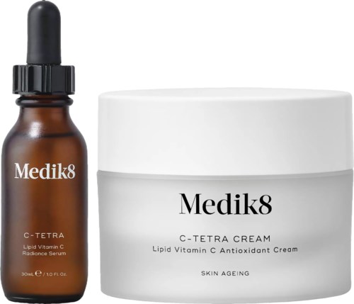 A brown dropper bottle and a white jar, both labeled Medik8 C-Tetra with skincare products for anti-ageing and vitamin C.