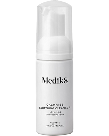 A white bottle with a pump, labeled Medik8 Calmwise soothing cleanser, 40ml, for calm and redness.
