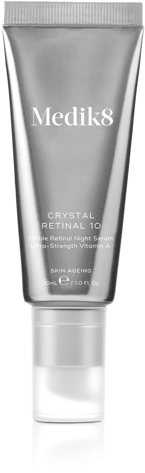 A cosmetic tube with Medik8 branding, mentions Crystal Retinal 10, and skin aging benefits, in silver and white colors.
