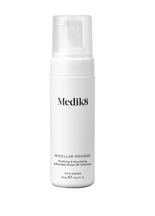 A white bottle labeled 'Medik8 Micellar Mousse' with a pump top. It is a cleansing foam for skin care.