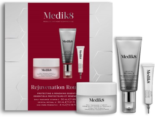 Set of Medik8 skincare products including cream, serum, and masks, arranged with a red background emphasizing Rejuvenation Range.