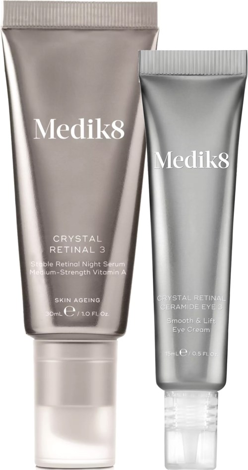 Two silver tubes of Medik8 skincare products, one larger and one smaller, with white text and caps.