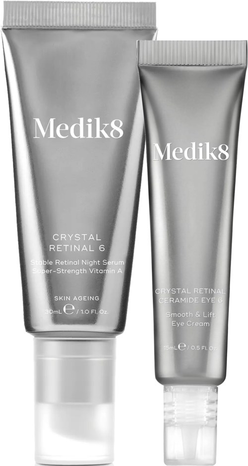 Two silver tubes of Medik8 skincare products, one larger and one smaller, with white text on the labels.