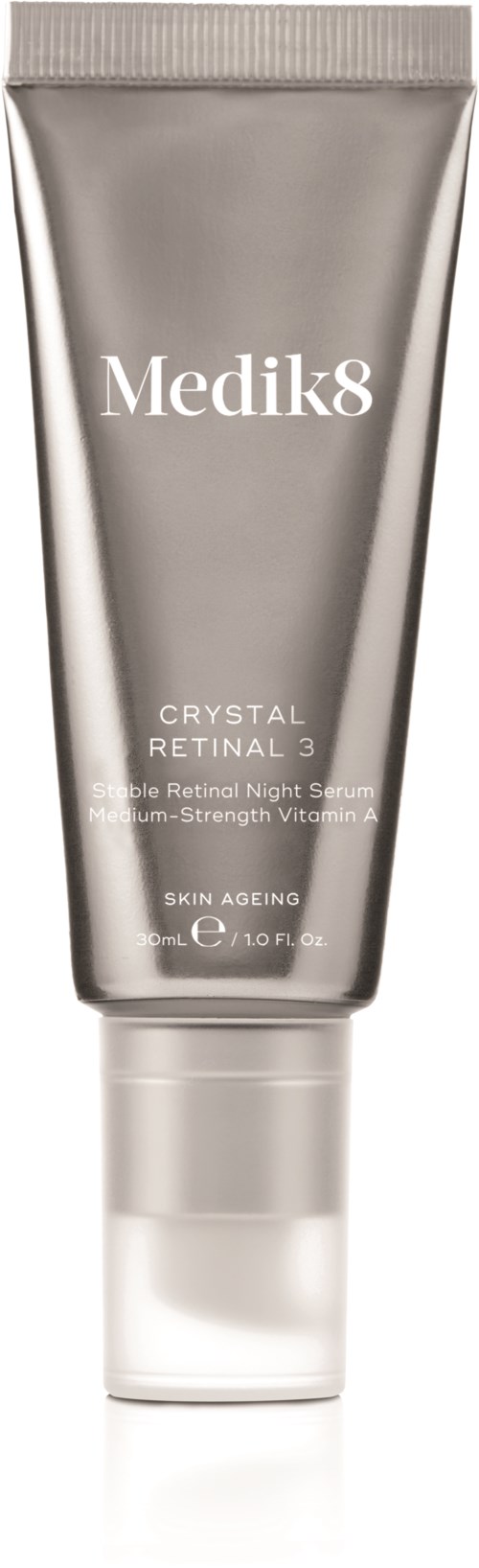 A silver tube of Medik8 skincare product, labeled 'Crystal Retinal 3' for night use and skin aging.