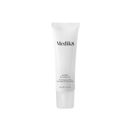 A white tube of Medik8 Sleep Glycolic with black text. It is a skincare product designed to help with sleep and skin renewal.