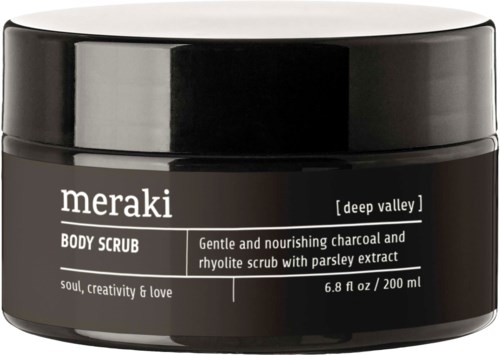 Meraki Deep Valley Körperscrub-Behälter mit schwarz-weißer Etikette, beschreibt Aktivkohle und Rhabarber Zutaten.
