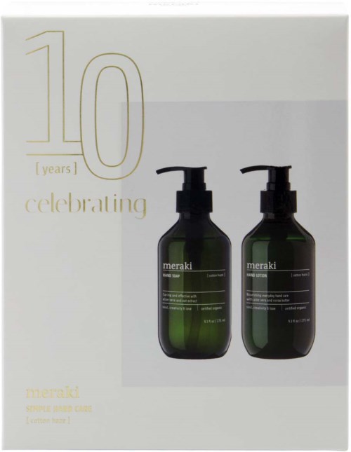 Two dark green Meraki bottles with pump tops on a white background celebrating 10 years.