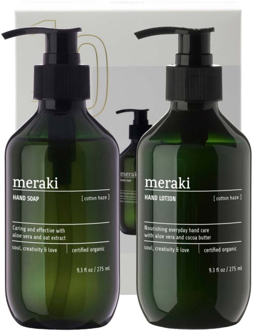 Three dark green bottles with black pump dispensers, labeled Meraki hand soap, hand lotion, and a smaller bottle in the background.