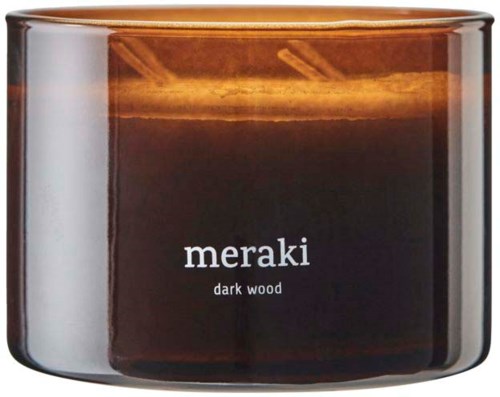 Ett mörkbrunt, runt ljusglas märkt 'meraki dark wood' på framsidan. Glaset ser glansigt och reflekterande ut.